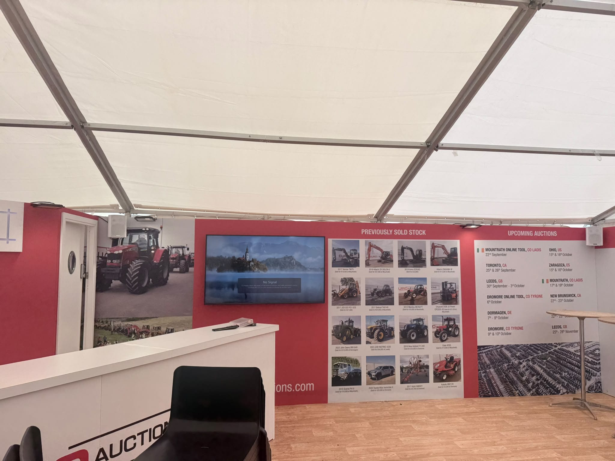 Euro Auctions graphic wall at the National Ploughing Championships showing previously sold stock and upcoming auction dates