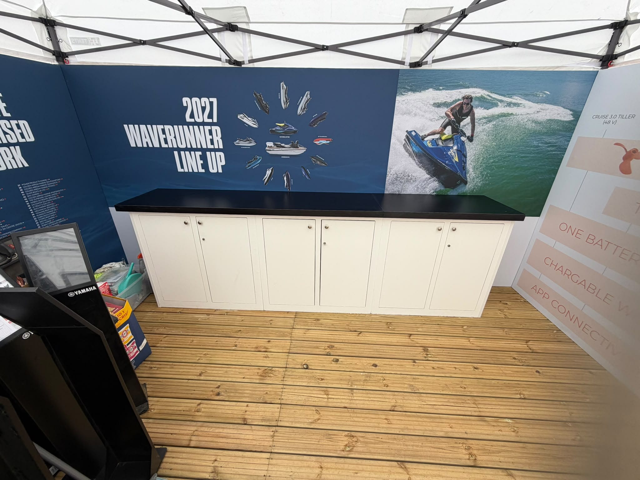 Branded interior walling with lockable cupboards inside the stand's waterproof tent, Yamaha Southampton Boat Show 2026
