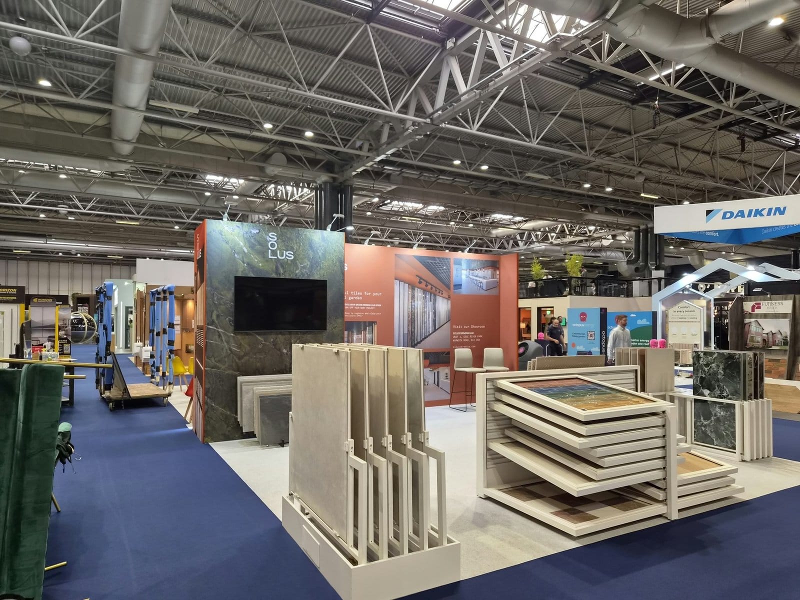Solus Ceramics stand with graphic-wrapped walls and tile displays at Grand Designs Live 2026
